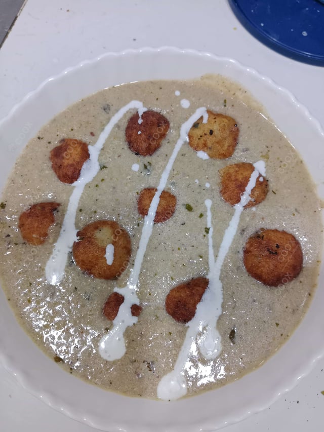 Tasty Malai Kofta (White Gravy) cooked by COOX chefs cooks during occasions parties events at home