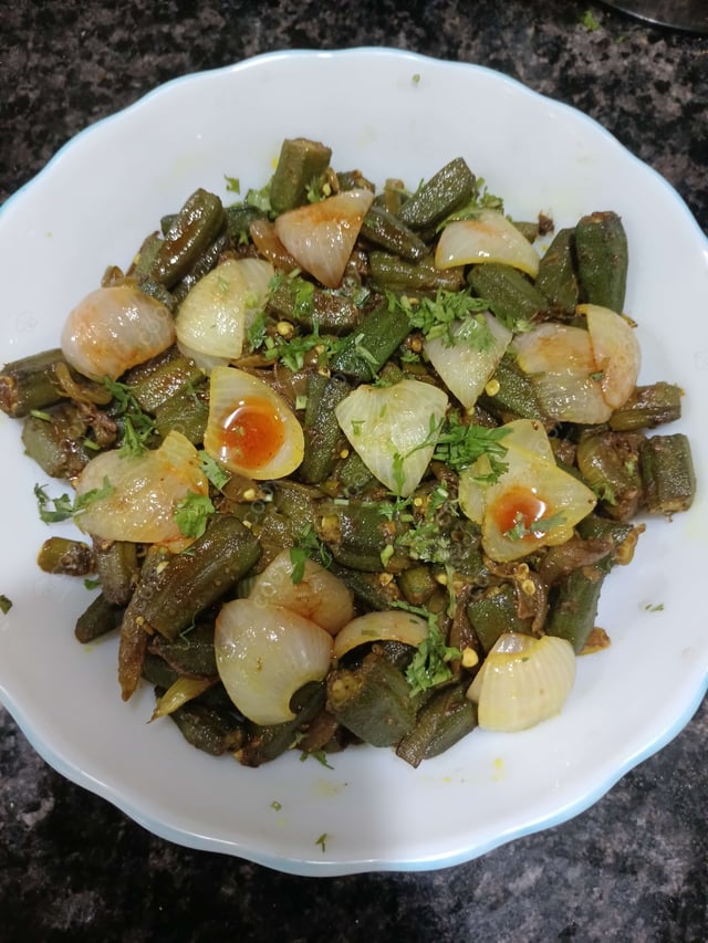 Tasty Bhindi do Pyaza cooked by COOX chefs cooks during occasions parties events at home