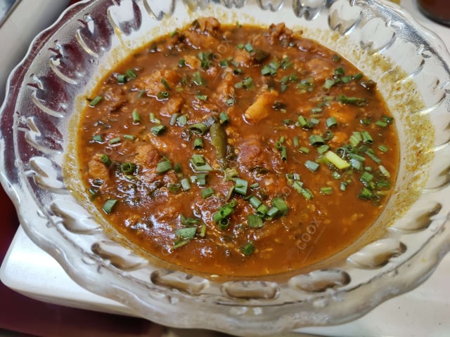 Tasty Chicken in Schezwan Sauce cooked by COOX chefs cooks during occasions parties events at home