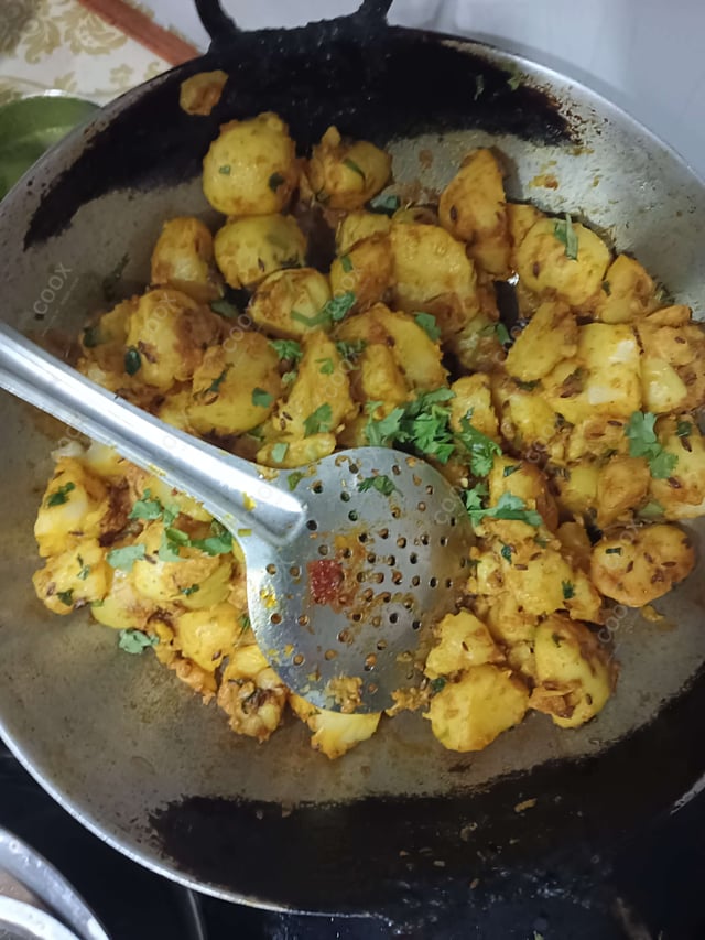 Delicious Jeera Aloo prepared by COOX