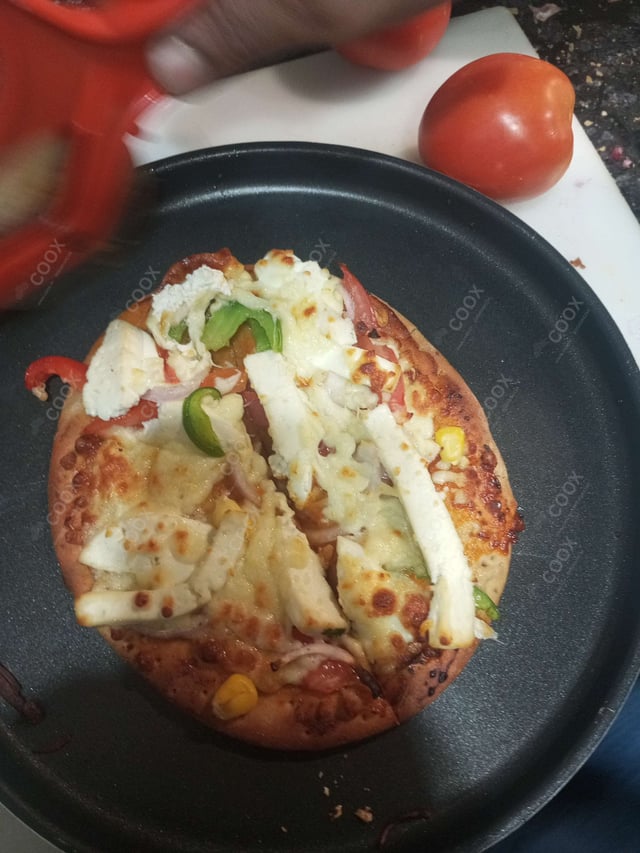 Delicious Veg Pizza prepared by COOX