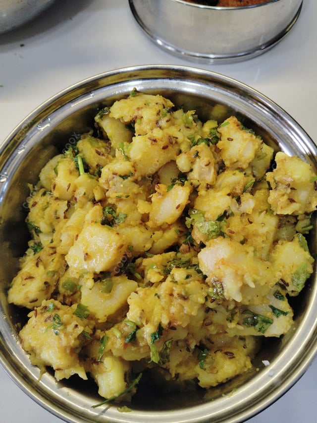 Delicious Jeera Aloo prepared by COOX