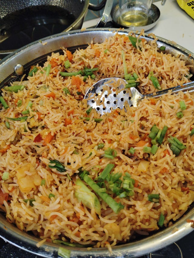 Delicious Schezwan Fried Rice prepared by COOX