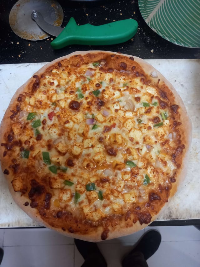 Delicious Chicken Pizza prepared by COOX