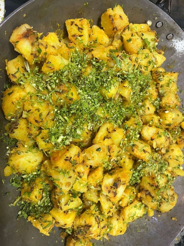 Delicious Jeera Aloo prepared by COOX