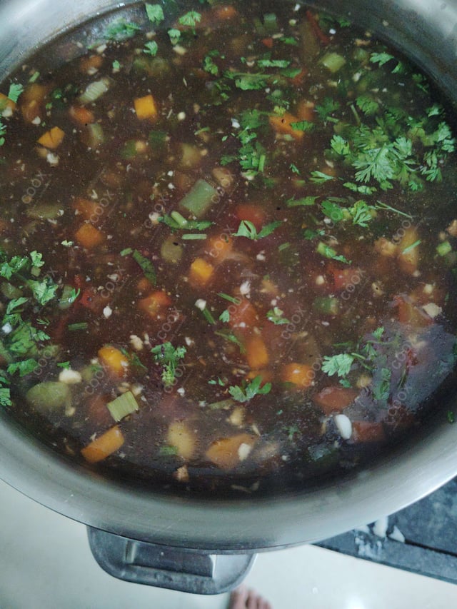 Delicious Vegetable Manchow Soup prepared by COOX