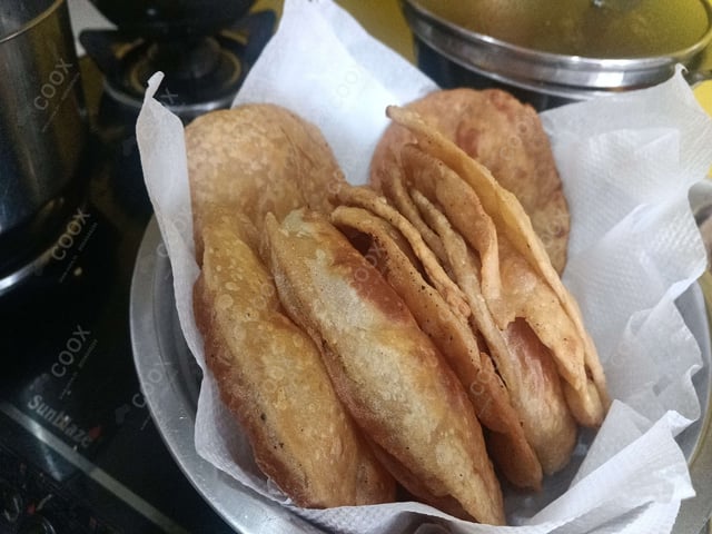 Delicious Pooris & Bedmis prepared by COOX