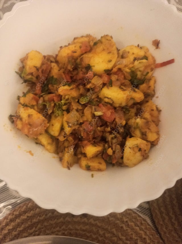 Delicious Jeera Aloo prepared by COOX