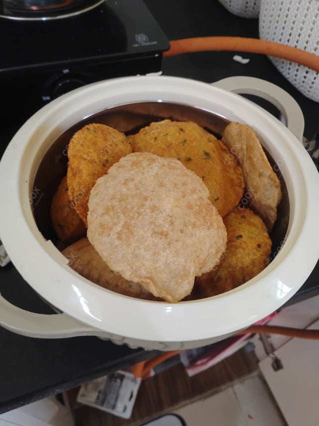 Delicious Pooris & Bedmis prepared by COOX