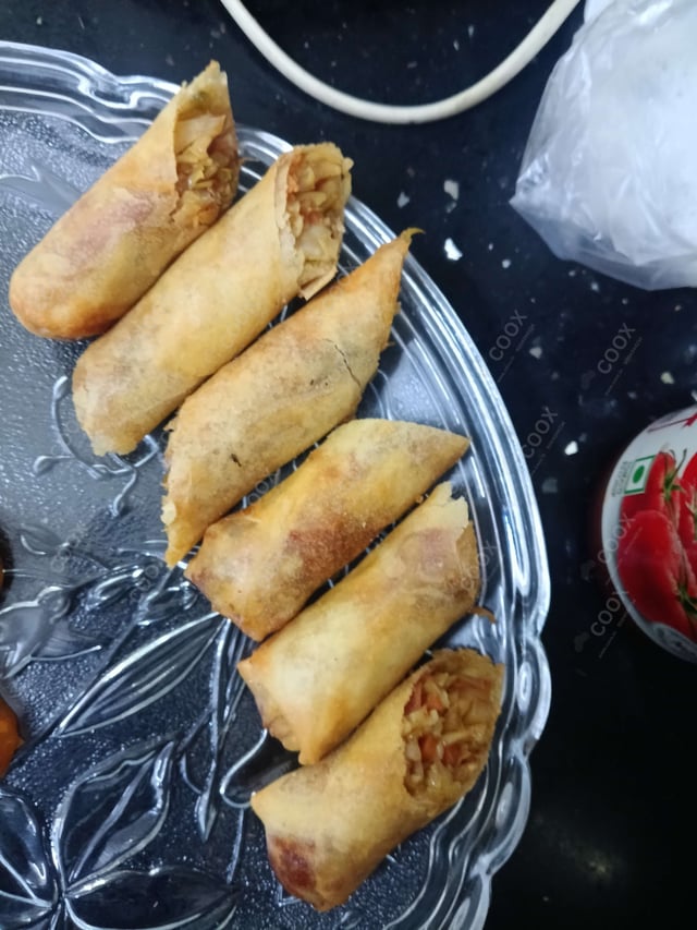 Delicious Veg Spring Rolls prepared by COOX