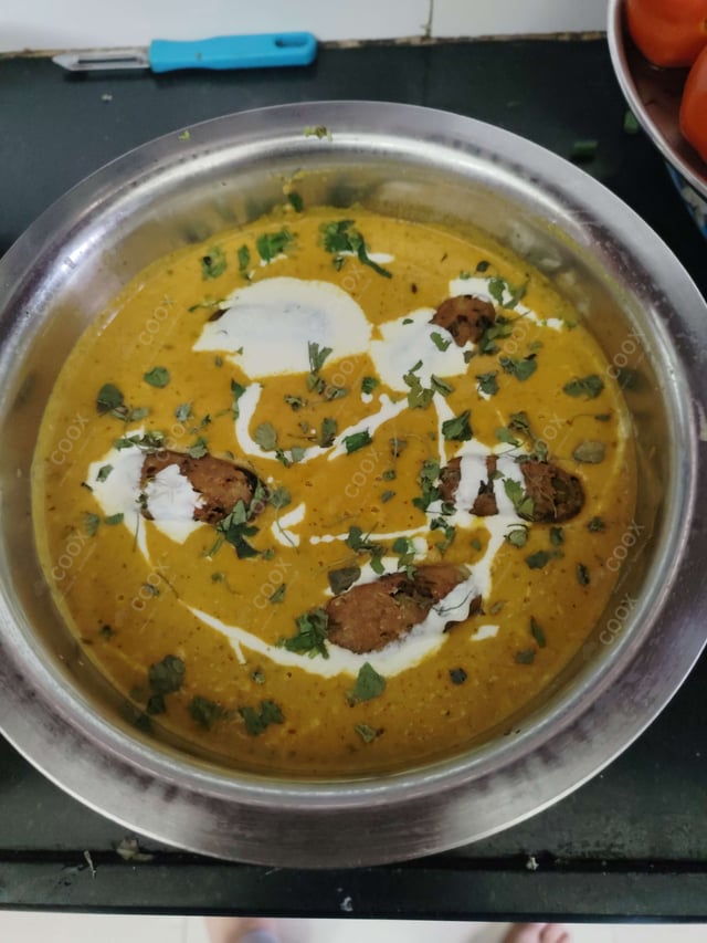 Delicious Malai Kofta (Orange Gravy) prepared by COOX