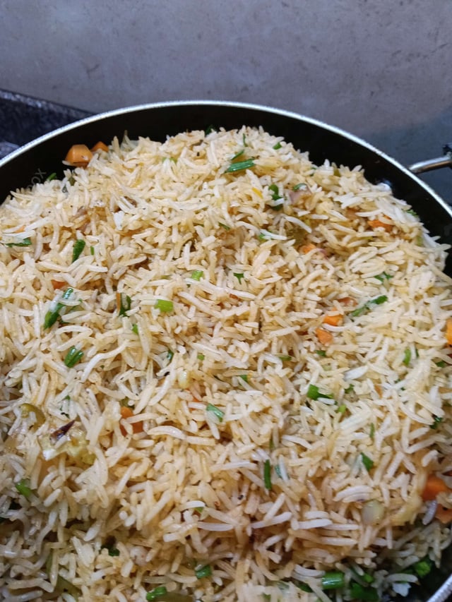 Delicious Schezwan Fried Rice prepared by COOX