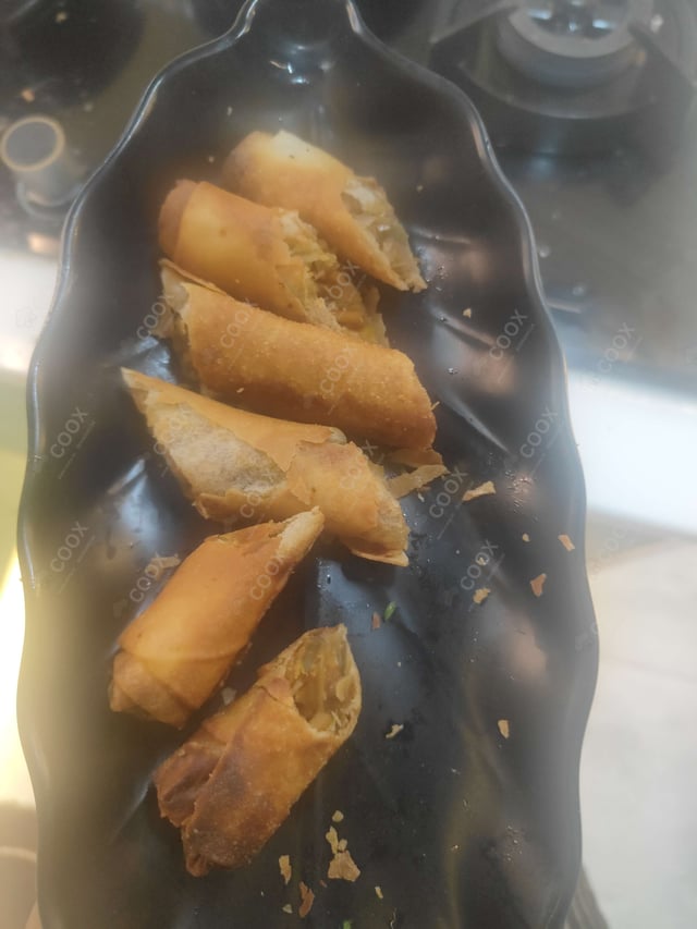 Delicious Veg Spring Rolls prepared by COOX