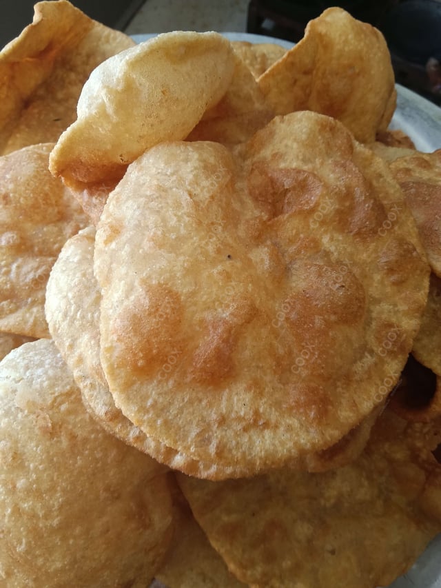 Delicious Pooris & Bedmis prepared by COOX