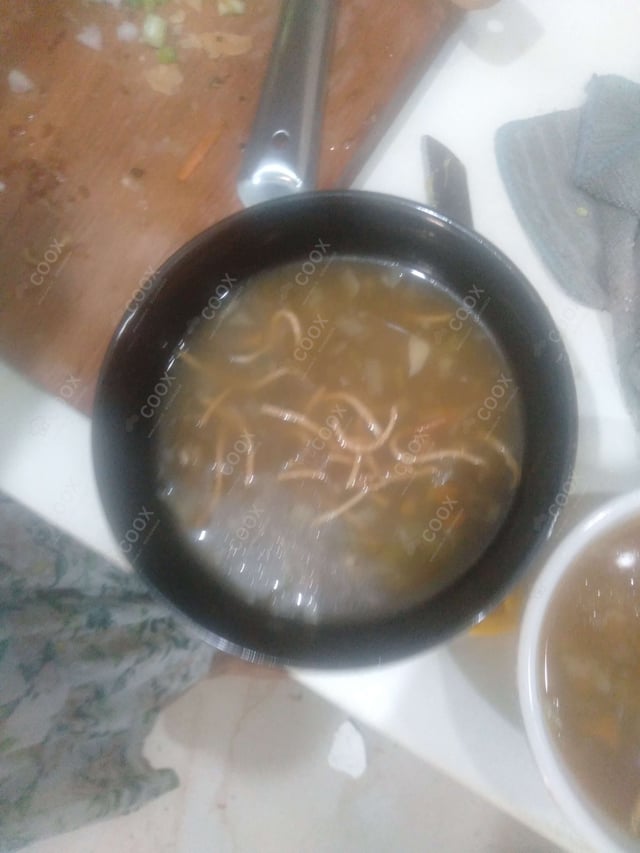 Delicious Vegetable Manchow Soup prepared by COOX