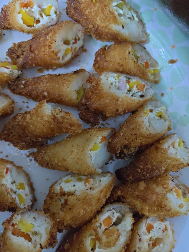 Delicious Dahi ke Sholey prepared by COOX