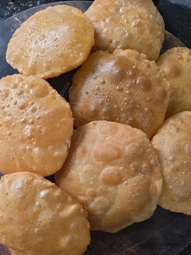 Delicious Pooris & Bedmis prepared by COOX