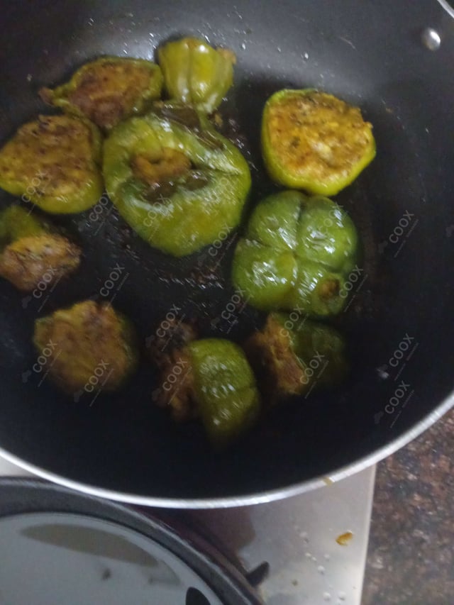 Delicious Bharwa Shimla Mirch prepared by COOX