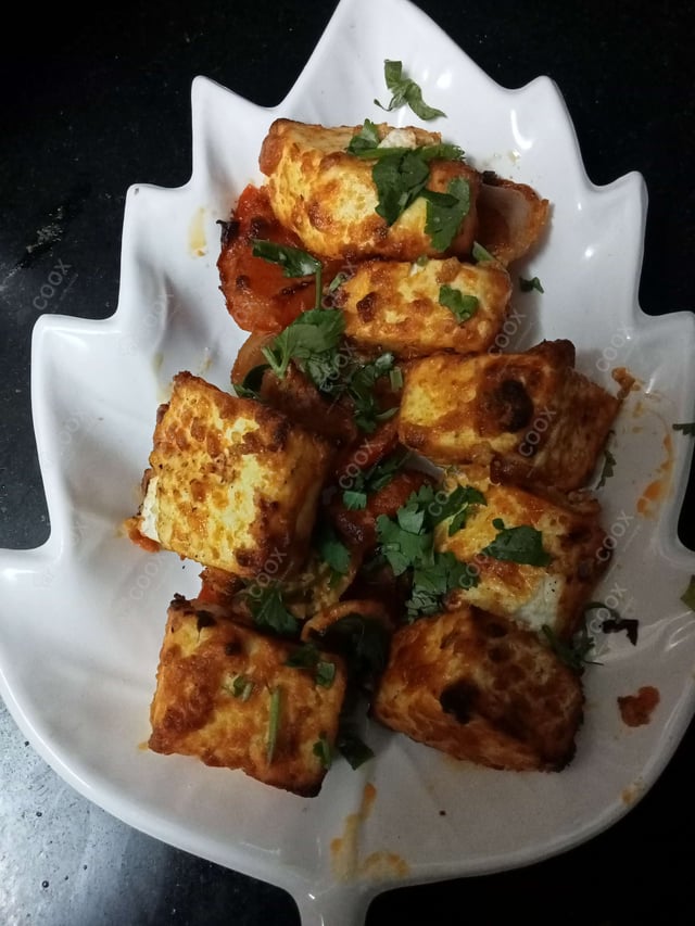 Delicious Paneer Tikka prepared by COOX