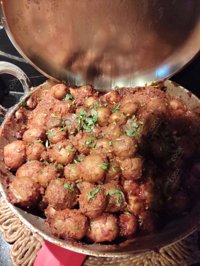 Delicious Dum Aloo prepared by COOX
