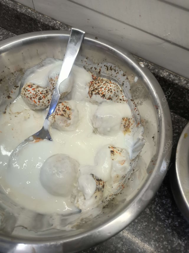 Delicious Dahi Bhalla prepared by COOX