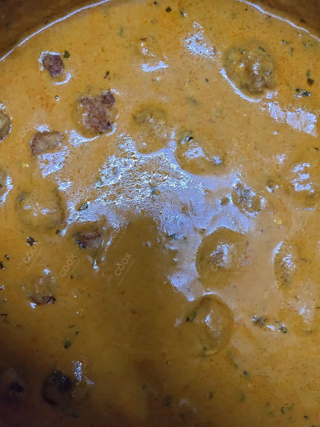 Delicious Malai Kofta (Orange Gravy) prepared by COOX