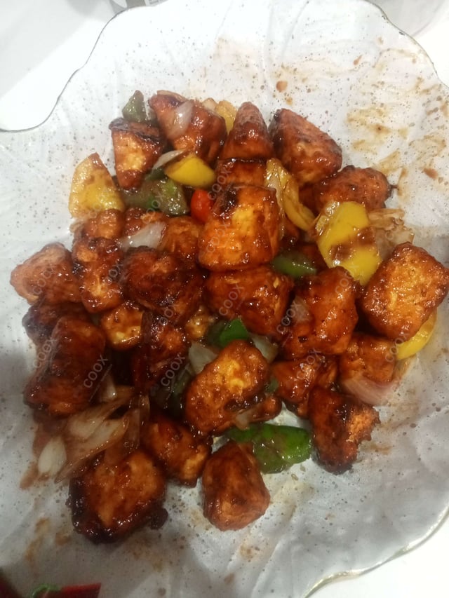 Delicious Chilli Paneer (Dry) prepared by COOX
