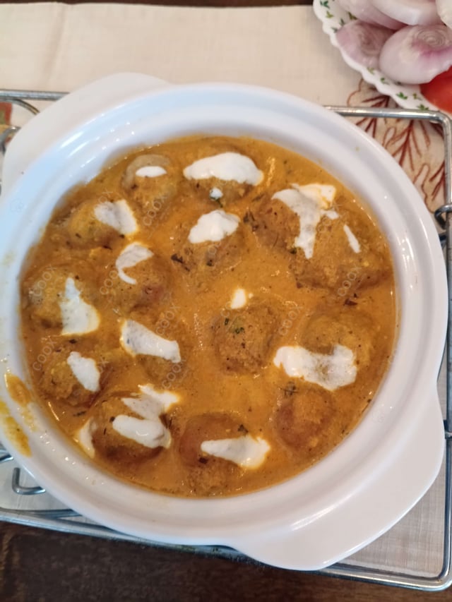 Delicious Malai Kofta (Orange Gravy) prepared by COOX