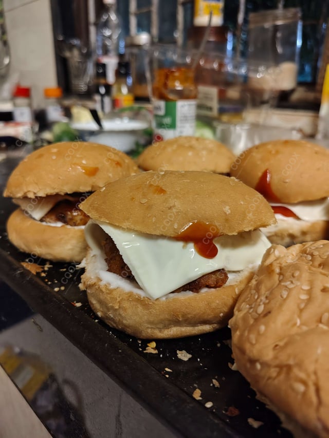 Delicious Mini Veg Burgers prepared by COOX
