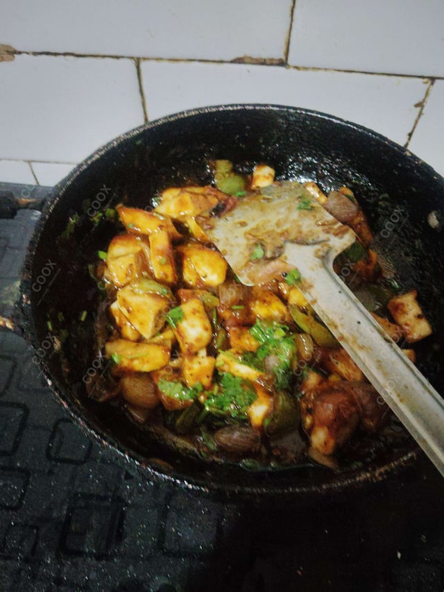 Delicious Chilli Paneer (Dry) prepared by COOX