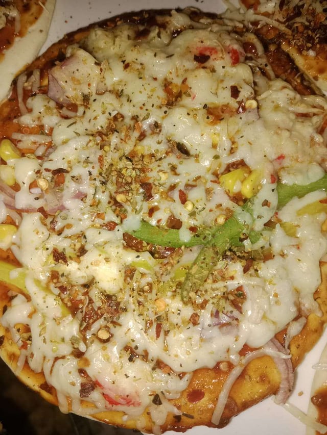 Delicious Veg Pizza prepared by COOX