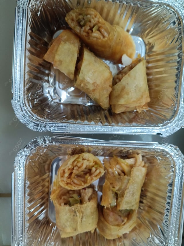 Delicious Chicken Spring Rolls prepared by COOX