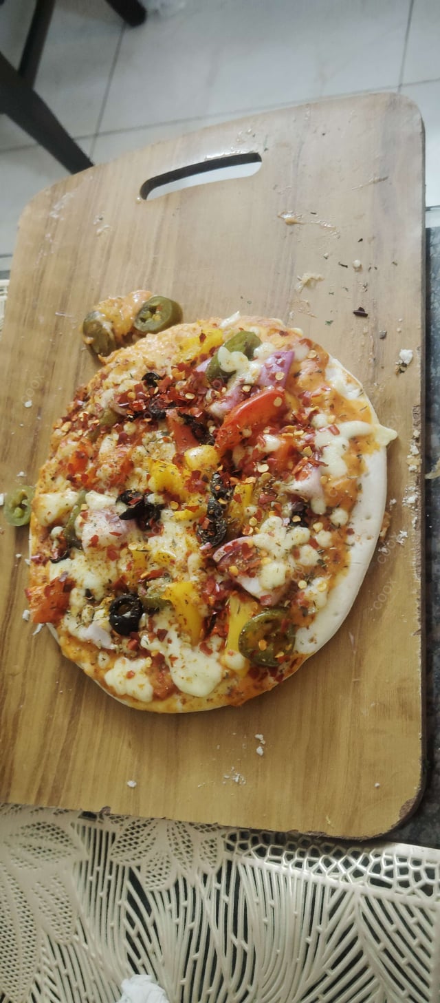 Delicious Veg Pizza prepared by COOX
